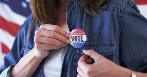 Middle-aged woman promotes voting with stylish denim look