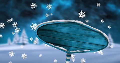 Snowy landscape with wooden signpost on winter night