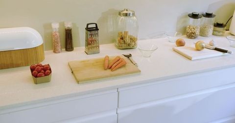 Modern Kitchen Counter with Cutting Board and Fresh Ingredients