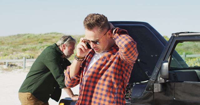 Men Stranded on Roadside with Broken Down Jeep - Download Free Stock Images Pikwizard.com