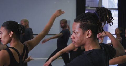 Diverse Dance Group Practising Contemporary Ballet Moves