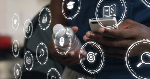 Male Hands Using Smartphone with Holographic UI Icons for Mobile Learning and Analytics