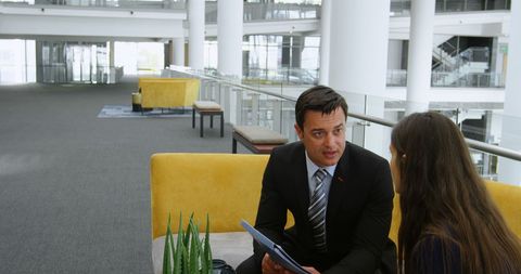 Business Professionals Meeting in Modern Office Lobby