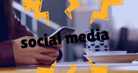 Person using smartphone for social media in café
