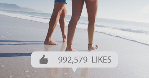 Couple Walking on Beach with Social Media Like Overlay