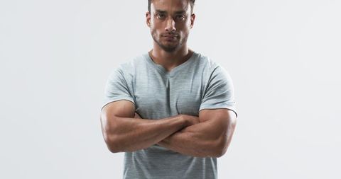Confident Male in Gray T-Shirt Expressing Determination and Attitude - Download Free Stock Images Pikwizard.com