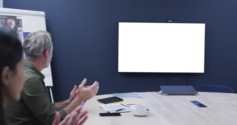 Team Collaboration with Blank TV Screen in Office Meeting