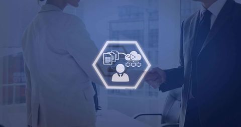 Shaking hands with glowing hexagon HUD showing cloud documents and team network in boardroom