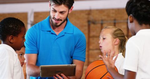Coach Discussing Strategy in School Basketball Gym - Download Free Stock Images Pikwizard.com