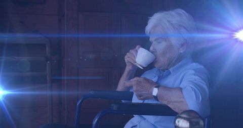 Senior Woman Enjoying Coffee in Wheelchair