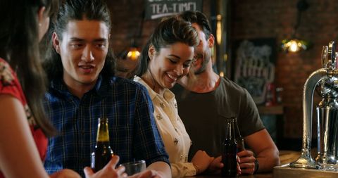 Friends Socializing at Trendy Pub with Beverages - Download Free Stock Images Pikwizard.com