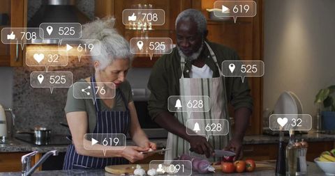 Senior couple cooking together in cozy kitchen with social media engagement overlays