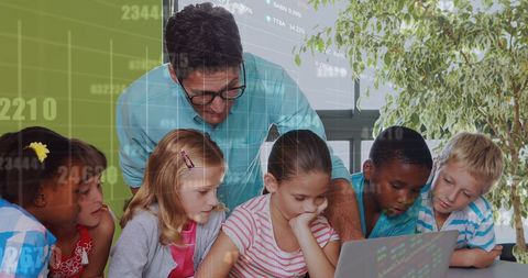 Teacher and Students Engaging with Technology and Financial Data - Download Free Stock Images Pikwizard.com