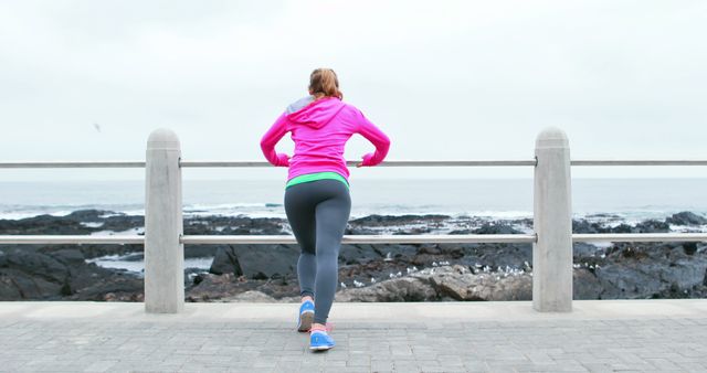Woman Stretching by Ocean in Activewear - Download Free Stock Images Pikwizard.com