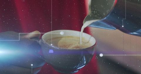 Barista pouring milk, creating latte foam swirl in ceramic cup, closeup with lens flare