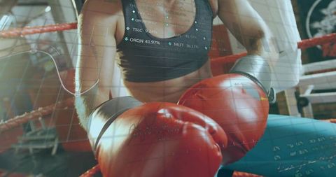 Female boxer leaning on ring ropes wearing red gloves with fitness data overlay