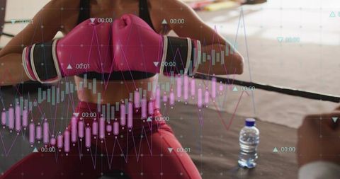 Female boxer bracing against resistance band in ring with fitness performance data overlay