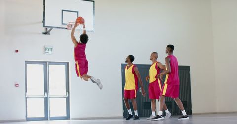 Basketball Team Playing with Energy Indoors Focus on Slam Dunk - Download Free Stock Images Pikwizard.com