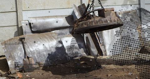 Magnetic claw crane in industrial junkyard recycling metal