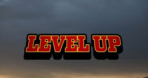 Level up text overlay against dramatic sunset sky