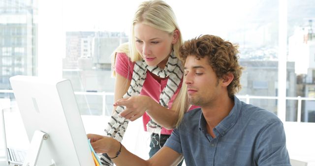 Young Professionals Collaborating on Computer in Modern Office - Download Free Stock Images Pikwizard.com