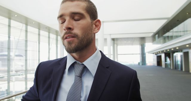 Businessman in Suit Taking a Pause in Modern Office Hallway - Download Free Stock Images Pikwizard.com