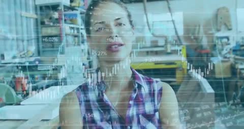 Confident Woman Analyzing Financial Data in Workshop