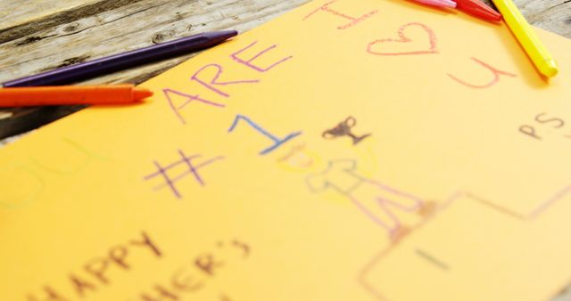 Close-up of Child's Drawing with Colorful Crayons on Wooden Table - Download Free Stock Images Pikwizard.com