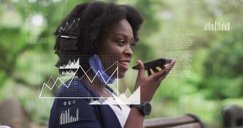 Black businesswoman speaking into smartphone holding watch, analytics charts park overlay