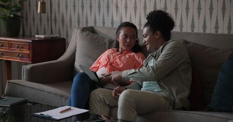 Couple Relaxing on Sofa in Cozy Living Room Atmosphere