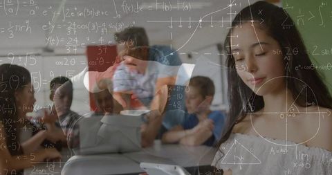 Math Formulas Overlaying Schoolgirl Using Smartphone in Classroom