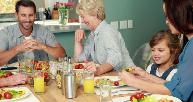 Multiple Generations Enjoying Meal Together at Dining Table - Download Free Stock Images Pikwizard.com