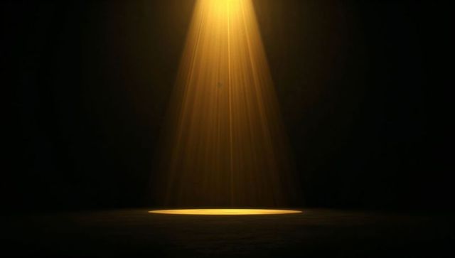 Golden Spotlight Beam Highlighting Empty Stage Circle of Light with Dust Particles