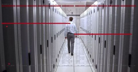 Technician Analyzing Data in Modern Data Center