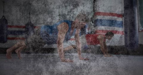 Athletic Men Performing Mountain Climbers in Martial Arts Gym