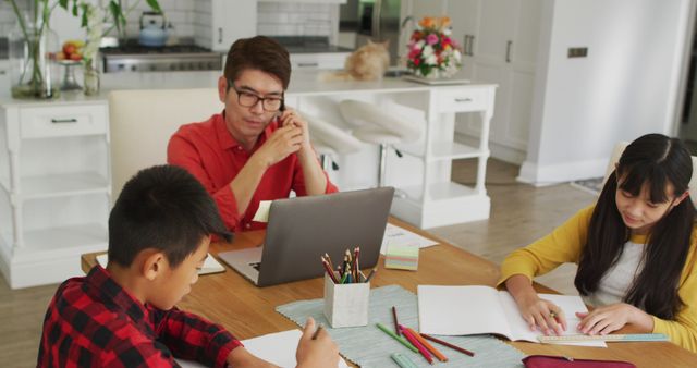 Father Working from Home Helping Kids with Schoolwork - Download Free Stock Images Pikwizard.com