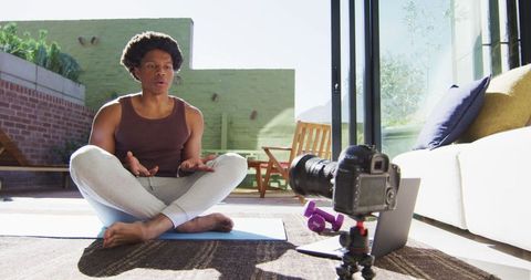 African American Man Filming Fitness Vlog at Home