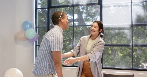 Joyful Birthday Celebration in Bright Office with Balloons