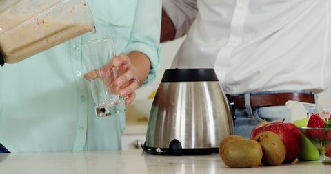 Couple Preparing Smoothie with Fresh Fruits in Modern Kitchen - Download Free Stock Images Pikwizard.com