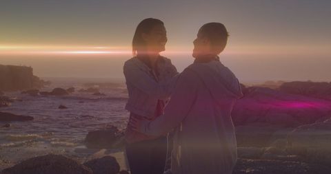 Romantic Couple Embracing at Sunset Beach