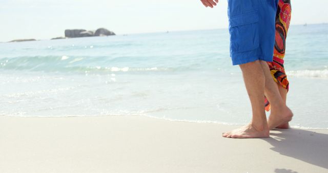Cute couple walking on the beach - Download Free Stock Photos Pikwizard.com