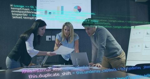 Team analyzing sales growth with modern technology in conference setting