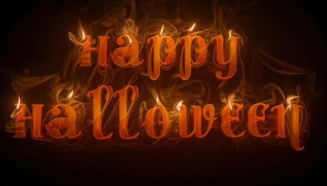Burning Wax Letters Spelling Happy Halloween Amidst Smoke