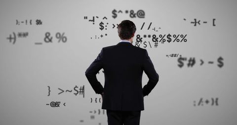 Businessman Analyzing Digital Symbols in Futuristic Interface - Download Free Stock Images Pikwizard.com