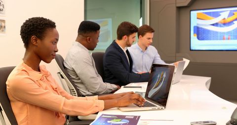 Diverse Business Team Using Laptops in Modern Office - Download Free Stock Images Pikwizard.com