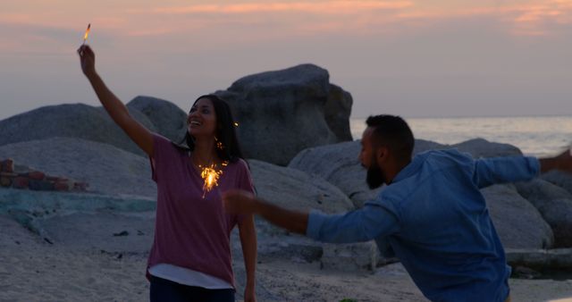 Happy Friends Celebrating with Sparklers on Beach at Sunset - Download Free Stock Images Pikwizard.com