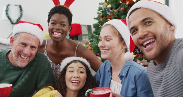 Diverse Group of Friends Celebrating Christmas with Santa Hats - Download Free Stock Images Pikwizard.com