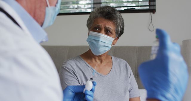 Senior Woman Receiving Vaccine from Doctor at Home - Download Free Stock Images Pikwizard.com