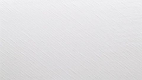 Macro close-up showing off-white textured surface with diagonal ridges and grooves