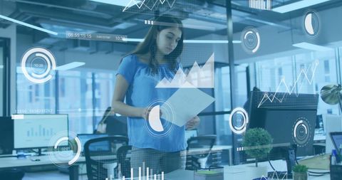 Businesswoman Analyzing Data with Augmented Reality Graphics